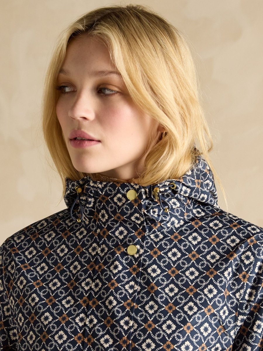 Holkham Navy Floral Waterproof Packable Raincoat With Hood - RUTHERFORD & Co