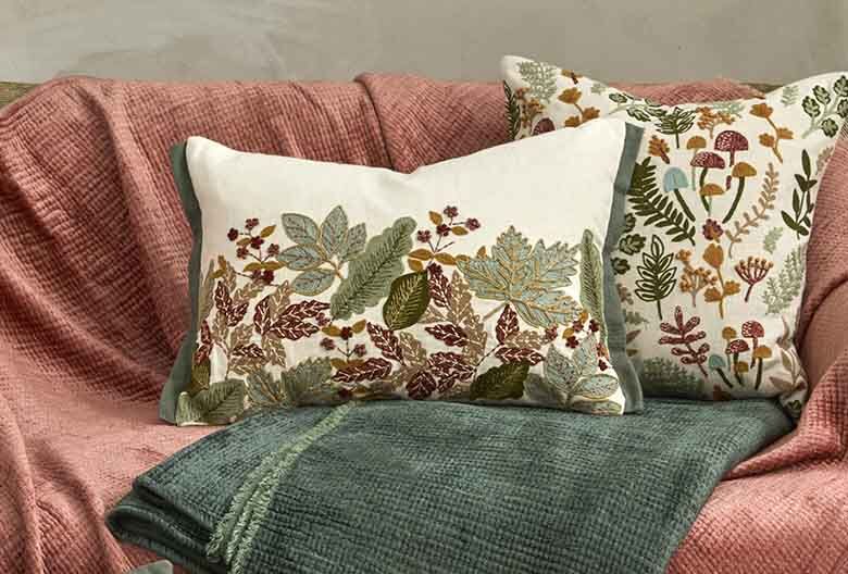 Embroidered hedgerow cushion
