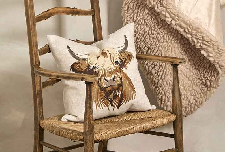 Embroidered highland cow cushion