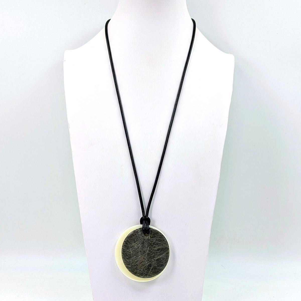Duo of round fibre effect resin shape on simple long wax cord necklace
