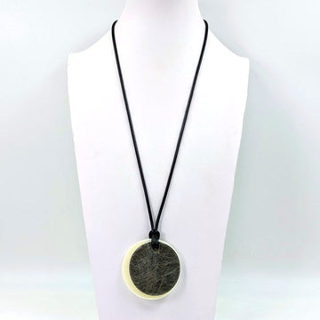 Duo of round fibre effect resin shape on simple long wax cord necklace