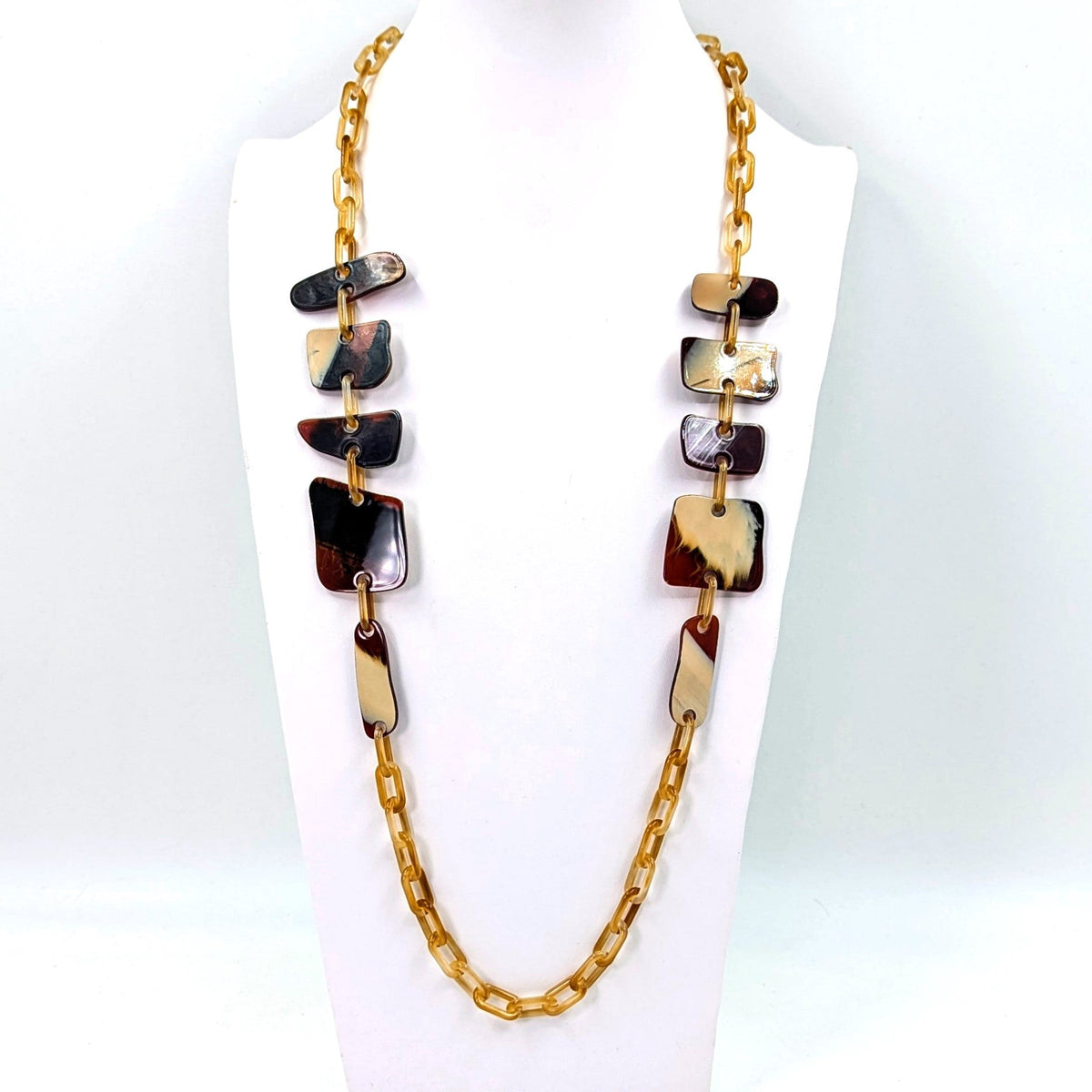 Flat rounded square resin shapes on long resin chain necklace