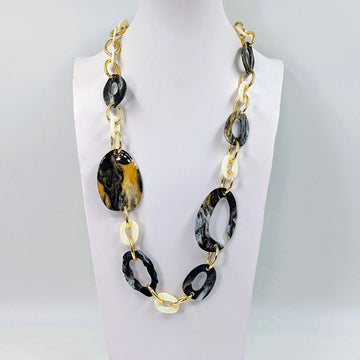 Substantial long organic resin shapes and golden links necklace