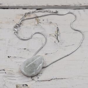 Resin centred pendant on rhodium snake chain necklace