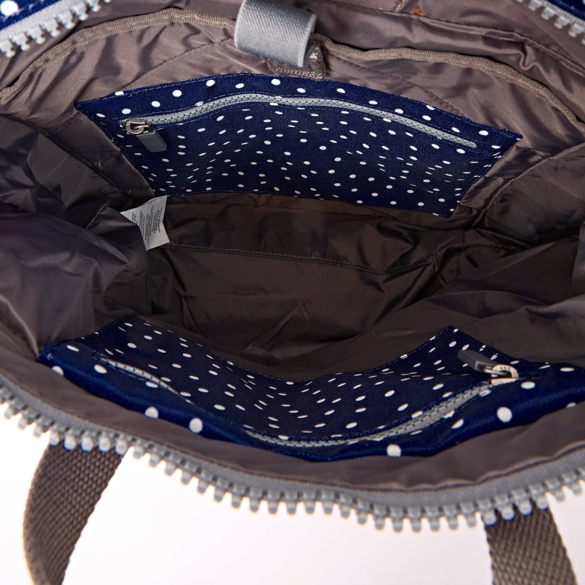 Canfield Roll Top Backpack in Navy Polka Dot - RUTHERFORD & Co