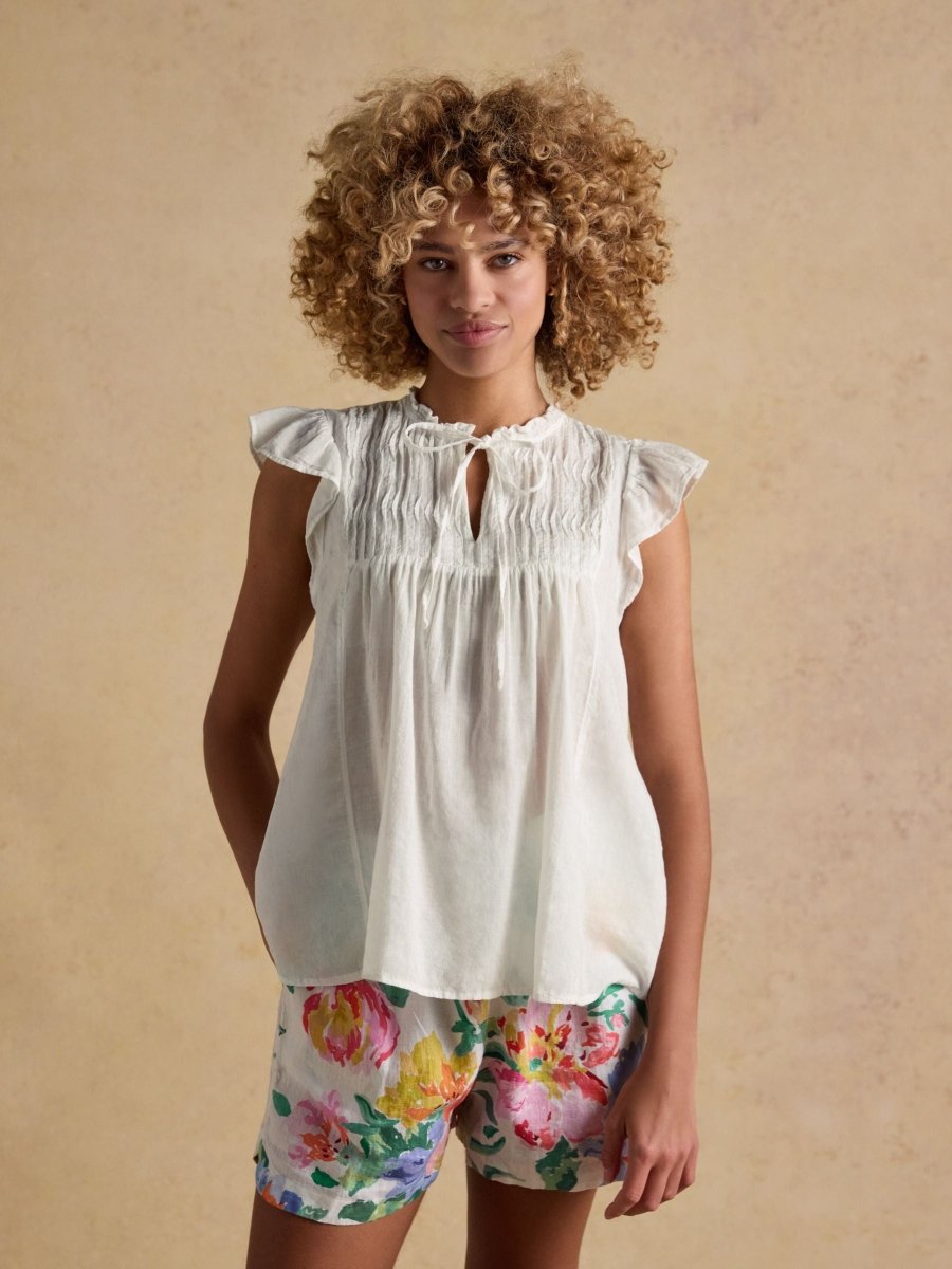 Nolan White Sleeveless Tie Neck Blouse - RUTHERFORD & Co
