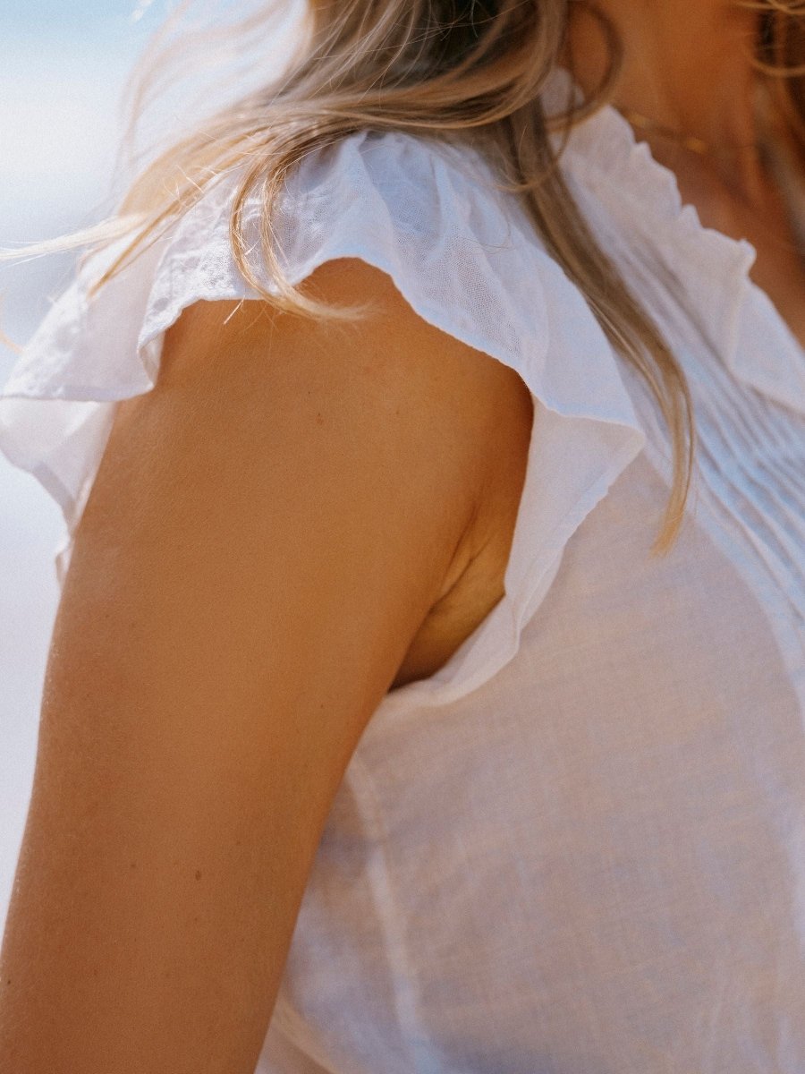 Nolan White Sleeveless Tie Neck Blouse - RUTHERFORD & Co