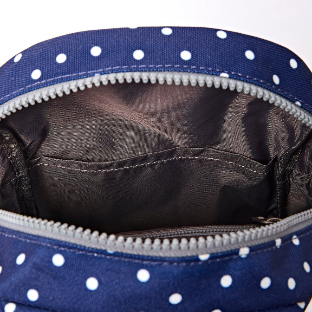 Willesden Sling Bag in Navy Polka Dot - RUTHERFORD & Co